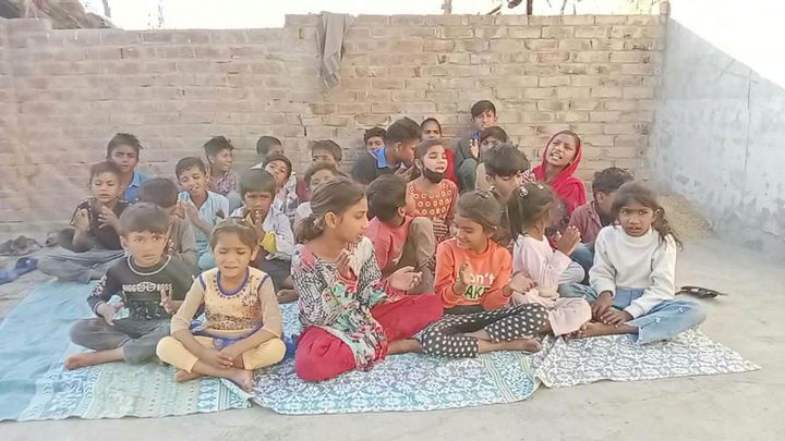 A photograph sent from the ministry in Pakistan: children and families gathered outdoors