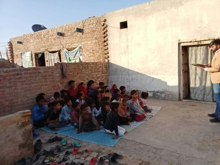 A photograph sent from the ministry in Pakistan: children and families gathered outdoors