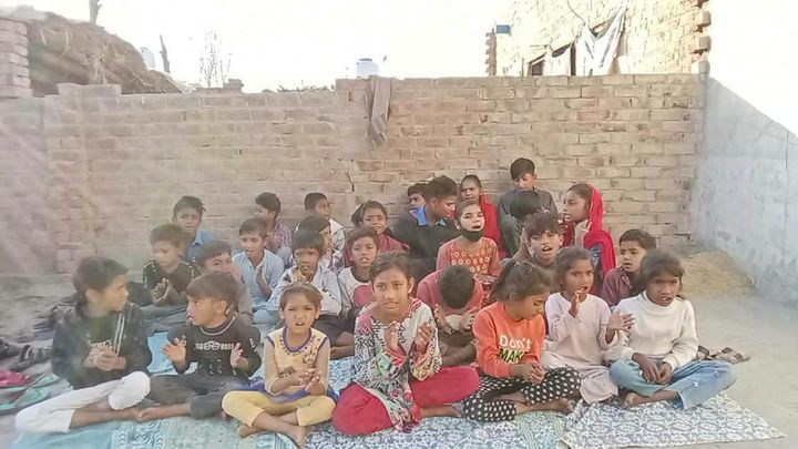 A photograph sent from the ministry in Pakistan: children and families gathered outdoors