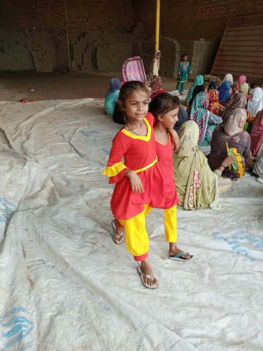 A photograph sent from the ministry in Pakistan: children and families gathered outdoors