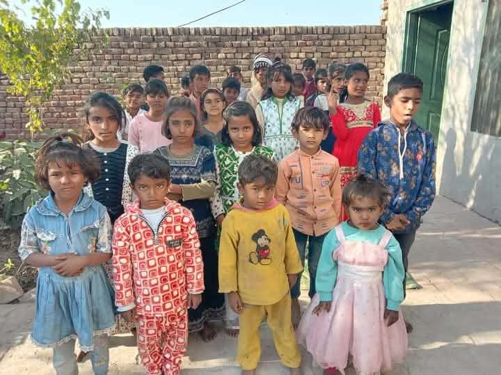 A photograph sent from the ministry in Pakistan: children and families gathered outdoors