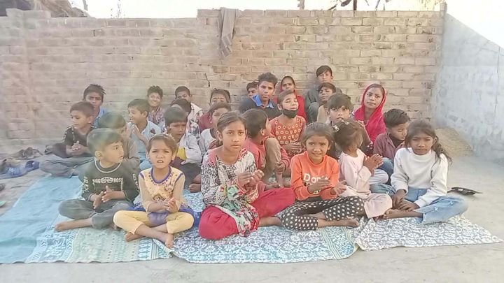 A photograph sent from the ministry in Pakistan: children and families gathered outdoors