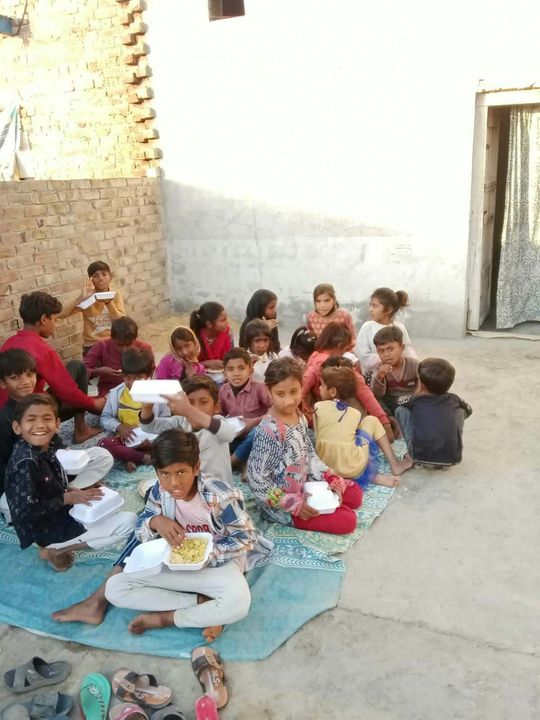 A photograph sent from the ministry in Pakistan: children and families gathered outdoors