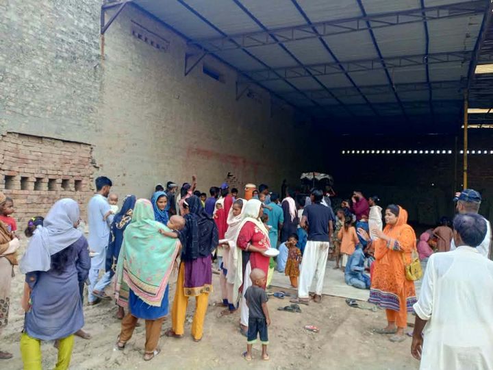 A photograph sent from the ministry in Pakistan: children and families gathered outdoors